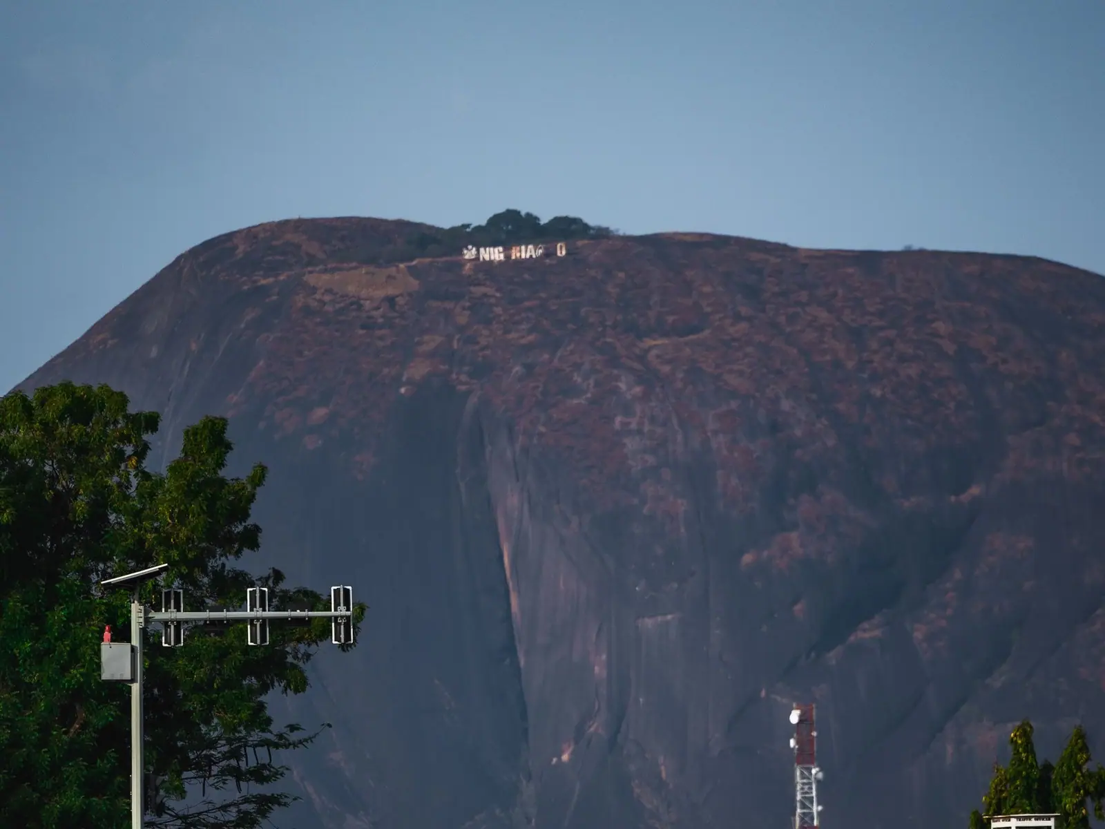 Aso Rock rising above the road into Asokoro, Abuja
