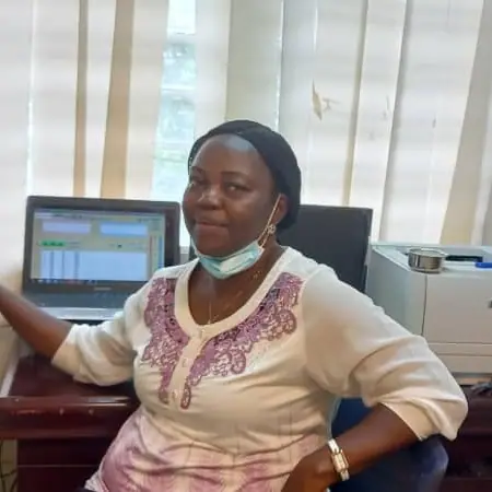 Dr. Adewumi Ojetoyinbo, Lead Audiologist at Blossom Hearing, at her clinic desk